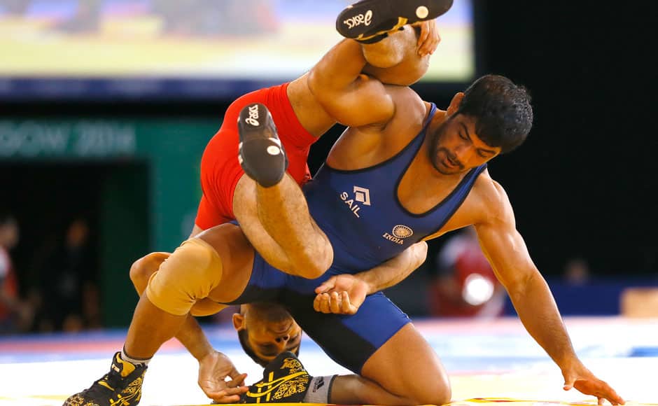 Sushil Kumar of India, right, wrestles with Qamar Abbas of Pakistan in a FS 74kg gold medal wrestling match at the Scottish Exhibition Conference Centre during the Commonwealth Games 2014 in Glasgow, Scotland, Tuesday July 29, 2014. AP