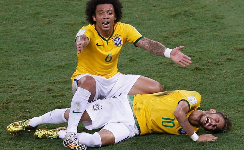 Brazil's Marcelo gestures over his injured teammate Neymar. The latter looked in terrible pain and had to be stretchered off. Reuters