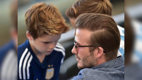 David Beckham, son Brooklyn escape unhurt in car crash