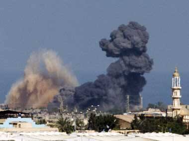 A picture taken from the Israeli border with the Gaza Strip shows smoke billowing from the coastal Palestinian enclave following an Israeli air strike on 16 July 2014. AFP