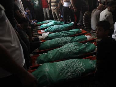 Relatives and friends gather to mourn for scores killed in Israeli air raids. AFP Image