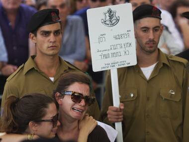 Israelis mourn during the funeral of Israeli soldier Amotz Greenberg in the central town of Hod Hasharon. Reuters Image