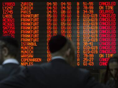 A departure time flight board displays various cancellations at Ben Gurion International airport in Tel Aviv. Reuters image