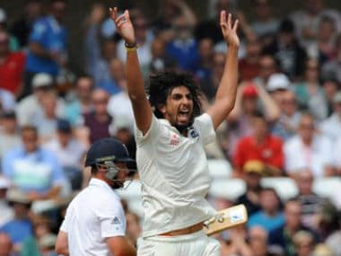 Ishant Sharma celebrates after bowling England's Ian Bell caught M S Dhoni for 25 runs during day three of the first Test between England and India. AP