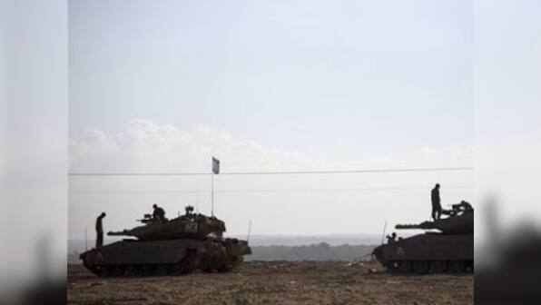 Israel hits 30 Gaza homes, kills senior Hamas leader 