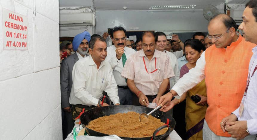 Union Minister for Finance Arun Jaitley and minister for commerce Nirmala Sitharaman participate in the 'halwa ceremony' marking the beginning of printing of budgetary documents. Markets will be hoping the budget is as sweet as the halwa the finance minister made. PTI image