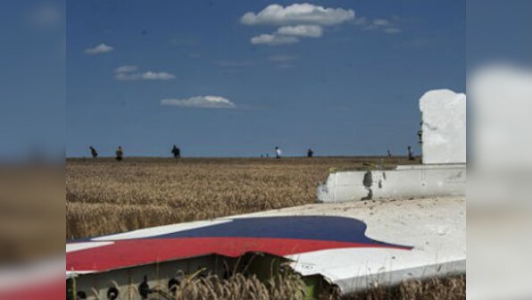 MH17 crash: Russia's Putin blames 'others' for exploiting tragedy