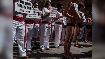 Spain's bull run begins in Pamplona amid protests