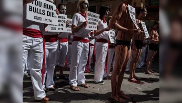 Spain's bull run begins in Pamplona amid protests
