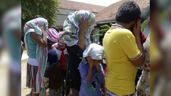 Aus immigration minister defends detention of child asylum-seekers