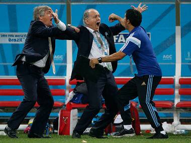 Argentina's coach Alejandro Sabella (C) celebrates after Maxi Rodriguez (not pictured converted the decisive penalty during a penalty shoot-out against the Netherlands. Reuters