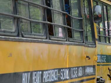Securing the students. AFP