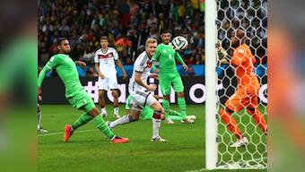 Germany score twice in extra time to edge past battling Algeria