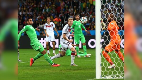 Germany score twice in extra time to edge past battling Algeria