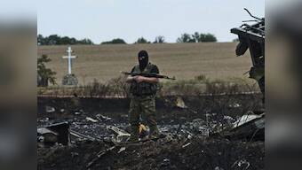 MH17 crash: Ukrainian workers find 21 more bodies at crash site 