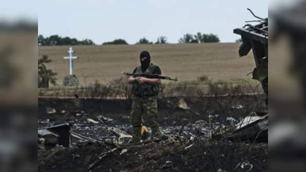 MH17 crash: Ukrainian workers find 21 more bodies at crash site 
