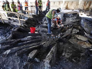 A pair of archaeologists begin dismantling the remains of an 18th century ship at the World Trade Center construction site in New York. AP