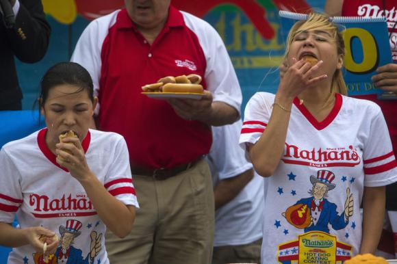 Hot dogs gobbled, small-town parades cheered as U.S. marks soggy July 4 ...