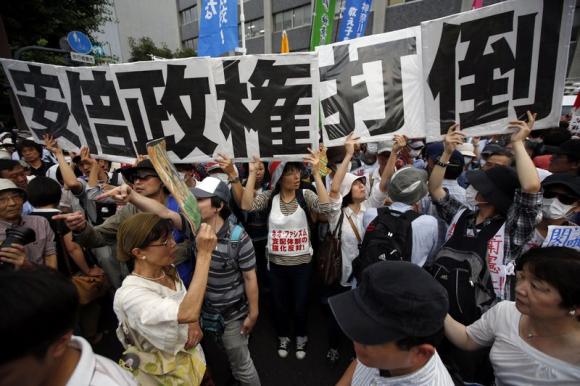 Japan takes historic step from post-war pacifism, OKs fighting for allies Japan takes historic step from post-war pacifism, OKs fighting for allies