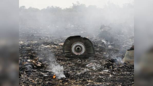 MH17 crash: Plane carrying remains of victims on way to Netherlands