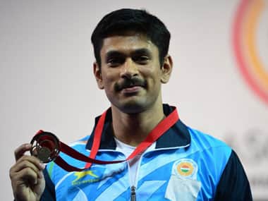 Omkar Otari with his bronze medal. AFP.