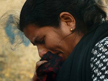 A woman breaks down during a protest rally against rape in Delhi. AFP.