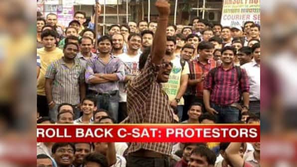 Delhi: UPSC protestors turn violent, torch buses and police booth 