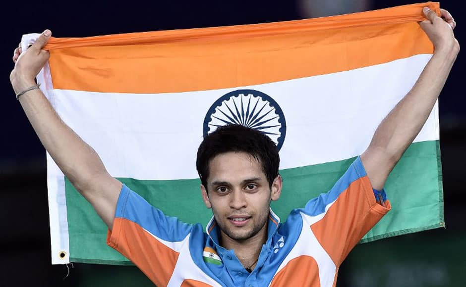 India’s Kashyap Parupalli holds his national flag as he celebrates beating Singapore’s Derek Wong in the men’s singles badminton gold medal final match at the Emirates Arena during the 2014 Commonwealth Games in Glasgow, Scotland, on August 3, 2014. Parupalli won 21-14, 11-21, 21-19. AFP