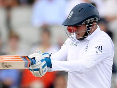 Stuart Broad edges the ball that gets stuck in the grill of his helmet from a delivery from India's Varun Aaron during the fourth Test at Old Trafford. Reuters