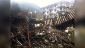 China: Rescuers race to find survivors after 381 die in earthquake