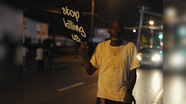 Police officer guns down black teen in St Louis, Missouri