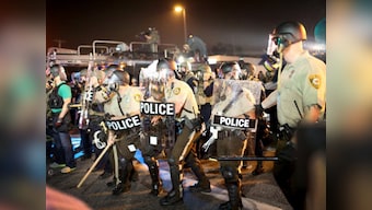 Ferguson shooting: Cop suspended for calling protestors rabid dogs