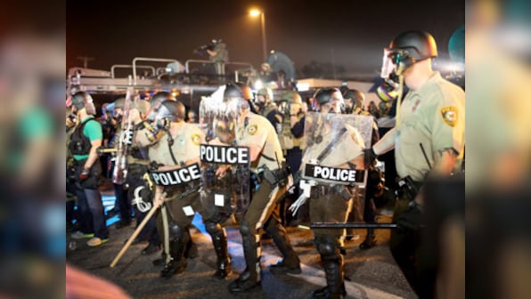 Ferguson shooting: Cop suspended for calling protestors rabid dogs