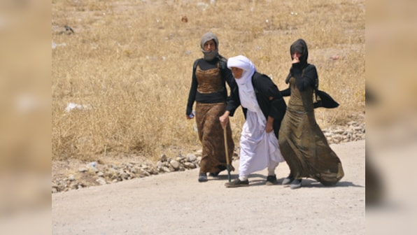 Iraq: Kurdish, Yazidis fighters battle Islamic State for strategic town of Sinjar