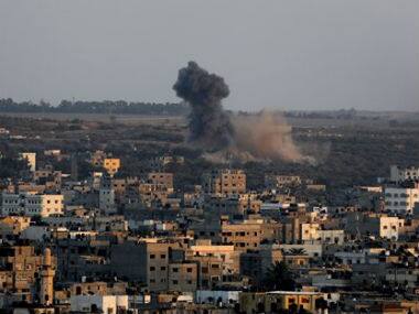 Smoke and dust rise after an Israeli strike hit Gaza City in the northern Gaza Strip. AP 