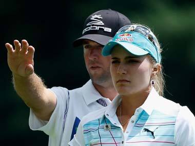 Lexi Thompson with her caddie. AFP