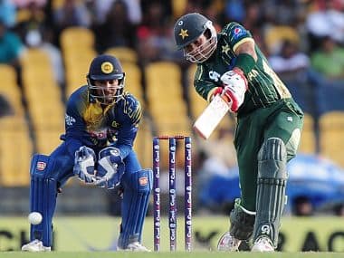Sohaib Maqsood (R) is watched by Kumar Sangakkara as he plays a shot during the first One Day International (ODI) match between Sri Lanka and Pakistan. AFP