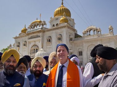 Nick Clegg is seen during a visit to the Golden Temple. AP
