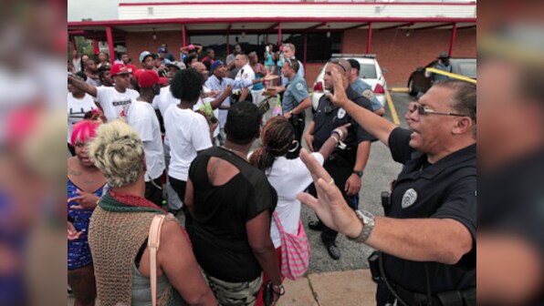 Curfew re-imposed in Ferguson as protest spirals
