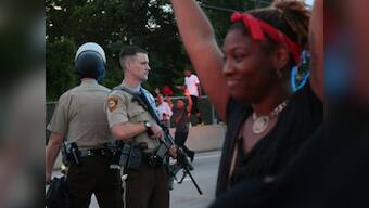 Ferguson unrest: Police shoot suspect dead near protest scene