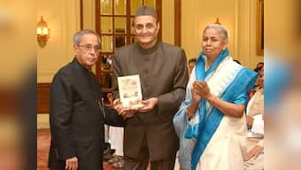 President receives first copy of book 'Munger Through The Ages'