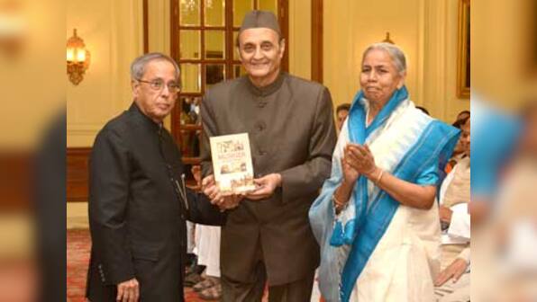 President receives first copy of book 'Munger Through The Ages'