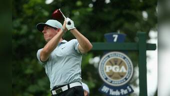Imperious McIlroy leads at PGA Championship; Tiger goes home