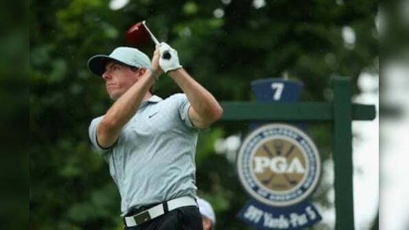 Imperious McIlroy leads at PGA Championship; Tiger goes home