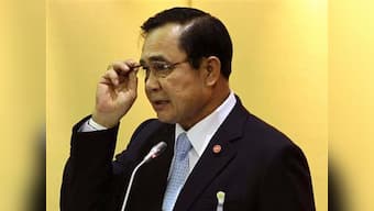 Thai military ruler ditches uniform for business suit