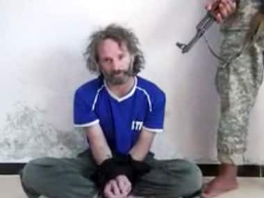 Screengrab of an undated video obtained shows a man believed to be Peter Theo Curtis held hostage by an al-Qaida linked group in Syria. Associated Press