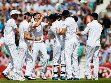 England's Chris Woakes, centre, celebrates with teammates after taking the wicket of India's Murali Vijay during the first day of the fifth test. AP