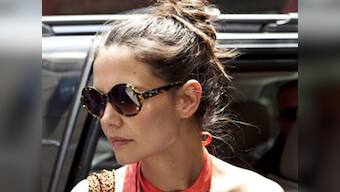 Holmes offers $1,000 reward for return of Suri's pet