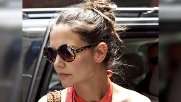 Holmes offers $1,000 reward for return of Suri's pet