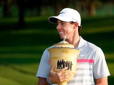 Rory McIlroy celebrates with the trophy following the final round of the WGC-Bridgestone Invitational golf tournament. Reuters